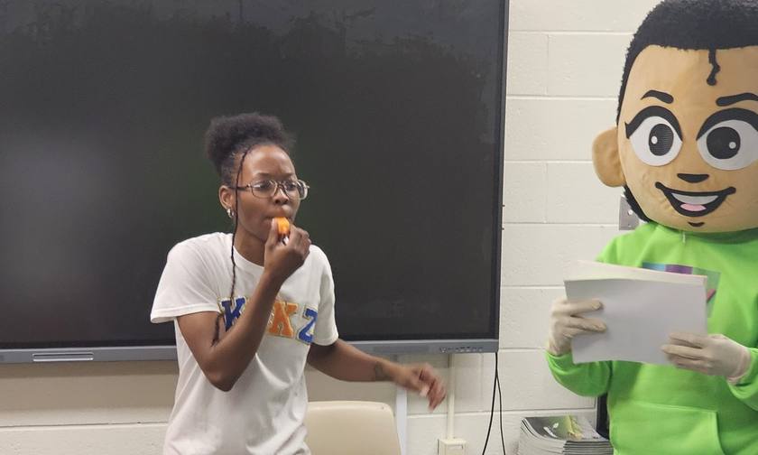 Emery and Kikz engaging with young students at a live KVK show